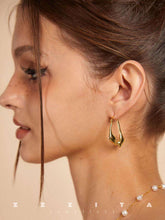 wearing Gold Rain-Drop Earrings